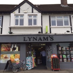 Lynams Newsagents - Shop front, with unlocked bike leaning up against it.
