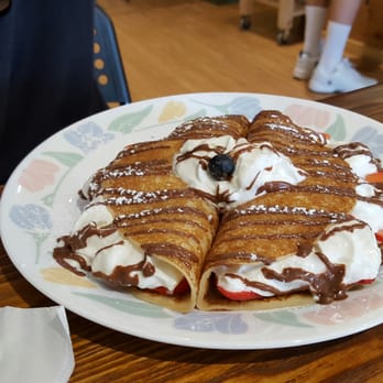 Around the World Cafe Bakery - Crepe with Nutella, cream, bananas, and strawberries - Cafes Near Me - Indialantic, Florida Around the World Cafe Bakery - Crepe with Nutella, cream, bananas, and strawberries - Cafes Near Me - Indialantic, Florida