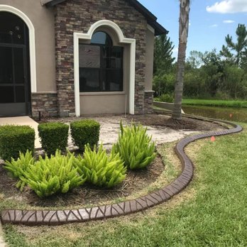 Curb Appeal Etc - a brick edging in front of a house - Landscape Architects or Designers Near Me
