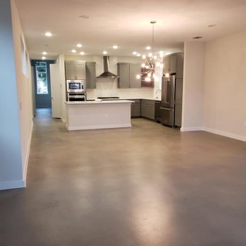 Concrete Canvas - an empty kitchen and living room - Flooring Near Me - Rowlett, Texas Concrete Canvas - an empty kitchen and living room - Flooring Near Me - Rowlett, Texas