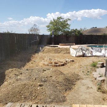 Heritage Landscape & Design - Here are the 2 mounds of dirt, dirt in those bags, and the wood and rock pieces. - Landscaping Near Me Heritage Landscape & Design - Here are the 2 mounds of dirt, dirt in those bags, and the wood and rock pieces. - Landscaping Near Me
