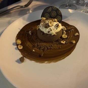Il Teatro - a chocolate dessert on a white plate - Italian Near Me - Quebec City, Quebec Il Teatro - a chocolate dessert on a white plate - Italian Near Me - Quebec City, Quebec