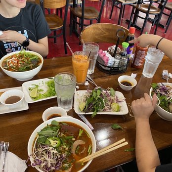 Bep Saigon Asian Kitchen - a group of people eating a meal - Vietnamese Near Me - Austin, Texas Bep Saigon Asian Kitchen - a group of people eating a meal - Vietnamese Near Me - Austin, Texas