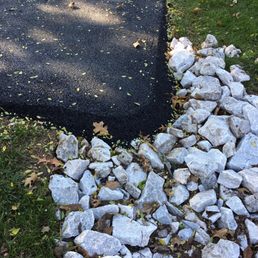 a pile of rocks on the side of a road