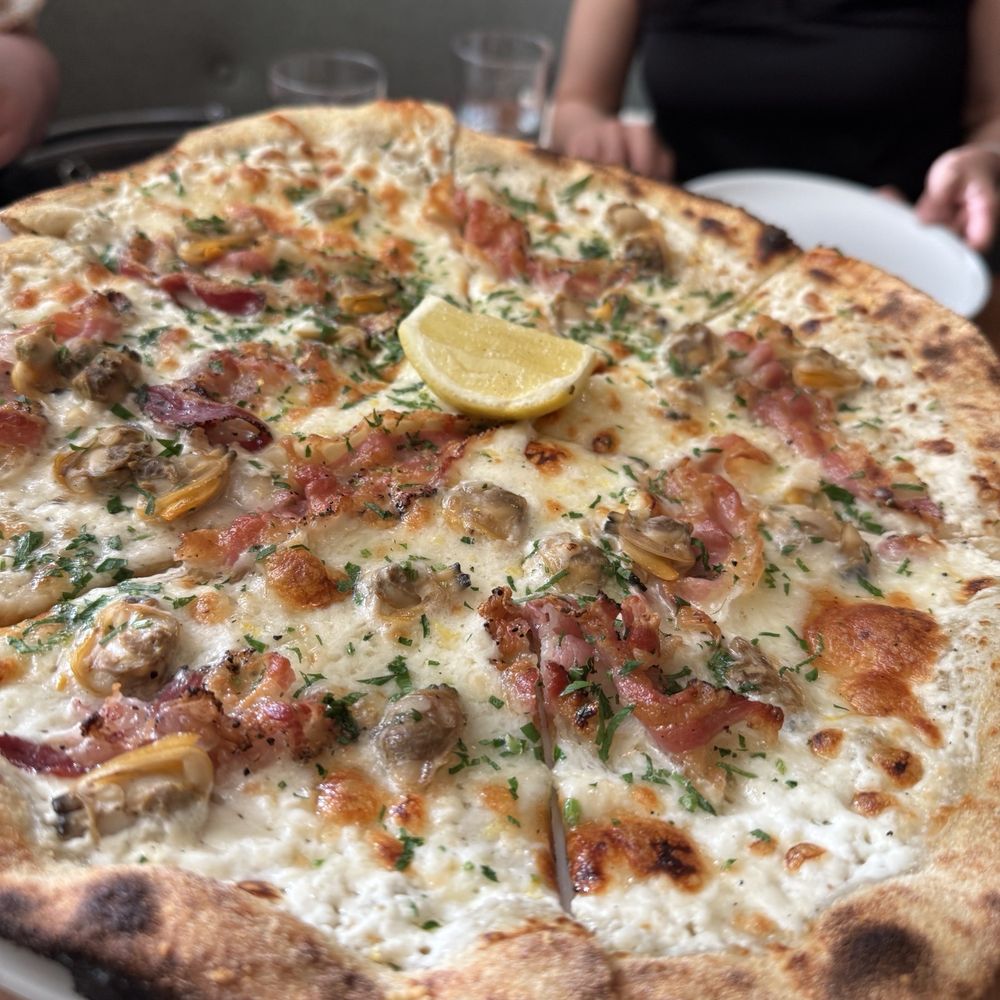 Osteria Elio Volpe - Manila clam pizza - Italian Near Me - Vancouver, British Columbia Osteria Elio Volpe - Manila clam pizza - Italian Near Me - Vancouver, British Columbia