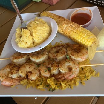 Crabby's Dockside - Grilled shrimp with seasoned corn and grits. - Seafood Near Me - Clearwater Beach, Florida
