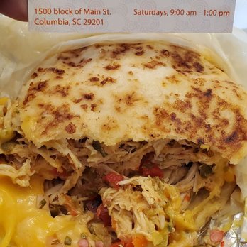 Mary's Arepas - a person holding a business card - Colombian Near Me - Columbia, South Carolina