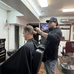 First Street Barber Shop - Robb with a client 2/7/25