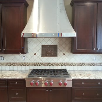 MDN Tile Company - a kitchen with a range hood - General Contractors Near Me - Dos Palos, California MDN Tile Company - a kitchen with a range hood - General Contractors Near Me - Dos Palos, California