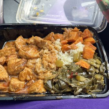Ruthie’s Kitchen - Butter chicken, rice, collard greens and candied yams. All very tasty. This is the lunch portion. - African Near Me - Masaryktown, Florida