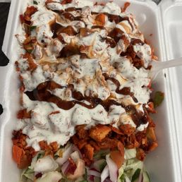 Chicken over rice white sauce, BBQ and hot sauce, I put my fries on the side and got extra meat. Chicken over rice white sauce, BBQ and hot sauce, I put my fries on the side and got extra meat.