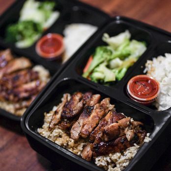 Tikiyaki - Teriyaki Chicken Plate split into two 3-section meal prep containers (still have extra food on the side!).  Brown rice, veggies, white rice. - Fast Food Near Me - Orange, California