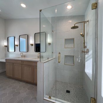 LJ Construct - a large bathroom with a walk in shower - General Contractors Near Me