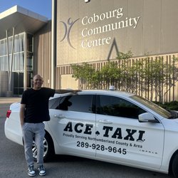 Ace Taxi - Driver Shane beside his white taxi