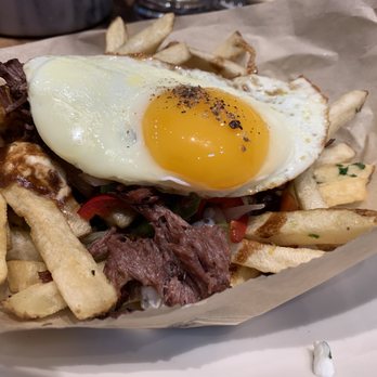 Whiskey Cake - Short Rib Poutine $5 - hand cut fries, beef pan jus, local goat cheese, pickled veg, sunny up local egg - New American Near Me - Irving, Texas