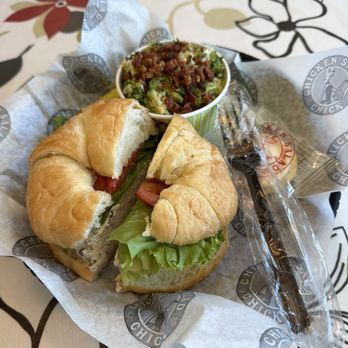 Chicken Salad Chick - Chicken salad sandwich with grapes in it, lettuce, on a croissant. Broccoli salad. - Chicken Shop Near Me - St Petersburg, Florida