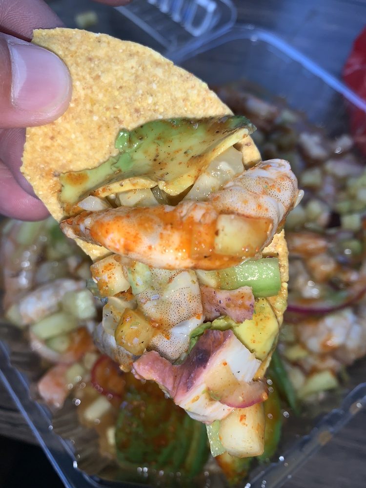 Lonchera De Mariscos El Kora Logo