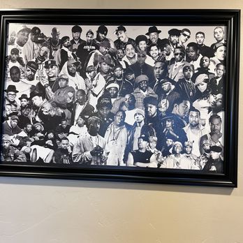 Phat Stax 505 - a black and white photo of a group of people - A black-and-white collage of numerous people, arranged in a dense group, is displayed in a black frame on a beige wall. The collage includes individuals of various ages, styles, and expressions, with some wearing hats, sunglasses, or casual clothing. The setting appears to be indoors, possibly in a restaurant, gallery, or community space, emphasizing a diverse group of people in a single image. - Food Trucks Near Me - Albuquerque, New Mexico