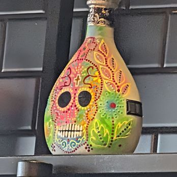 La Frida Mexican Grill & Seafood - This bottle of high end Tequila that sits on their shelf and legend has it that it was painted by female inmates in a Mexico prison. - Mexican Near Me - Tucson, Arizona