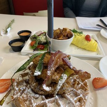 Brunch Junction - Up front:  the Chicken & Bacon Waffle Tower Behind:  The Longhorn Steak Omelette - Breakfast & Brunch Near Me - Pearland, Texas