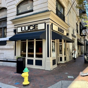 Luce - a yellow fire hydrant in front of a store - Italian Near Me - Norfolk, Virginia