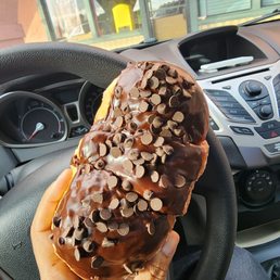 a person holding a doughnut