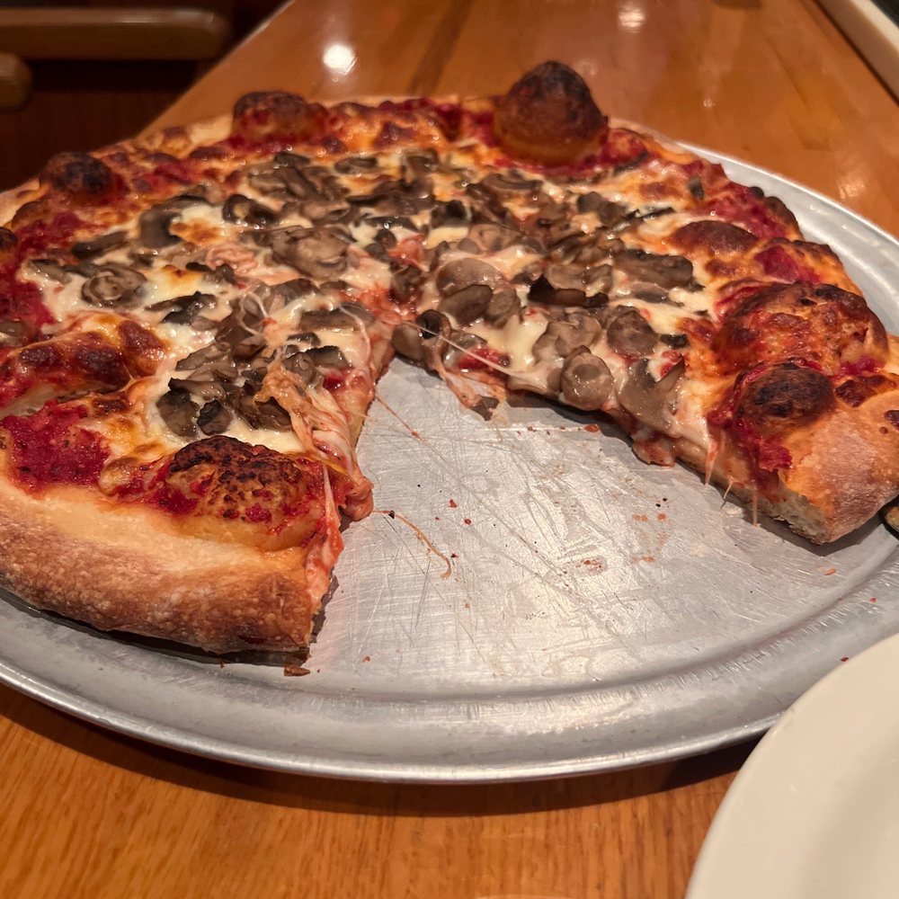 a half eaten pizza on a pan