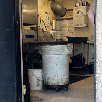 Rendezvous - The actual dishwasher.  Note the irony of a dirty "sanitizer" sign. - Cocktail Bars Near Me - O'fallon, Missouri