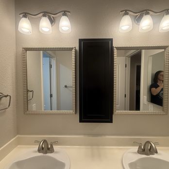 Cal Val Construction - New lights, sink fixtures, mini cabinet between new mirrors, and fresh paint - General Contractors Near Me
