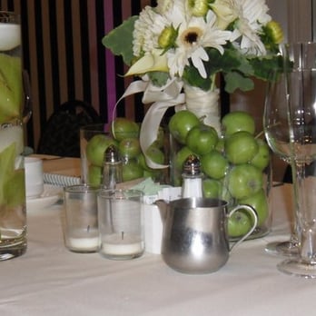 Arjan Flowers & Herbs - toss bouquet in vase of green apples and unity candle - Florists Near Me - Oakland, California Arjan Flowers & Herbs - toss bouquet in vase of green apples and unity candle - Florists Near Me - Oakland, California