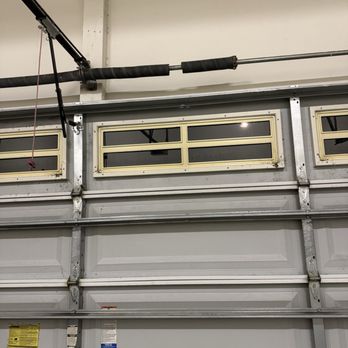 Garage Door Specialist - Uh oh...broken spring! Steel color - Garage Door Services Near Me - Raleigh, North Carolina