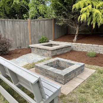 Tran's Landscaping & Gardening - Tom and his crew built the retaining wall, the garden bed (far left) and the square fire pit (center). - Landscaping Near Me