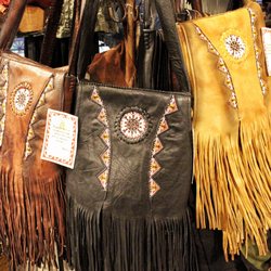 Third World Trading Company - Fun and flirty tassels on these leather bags are perfect for the boho chic in you.