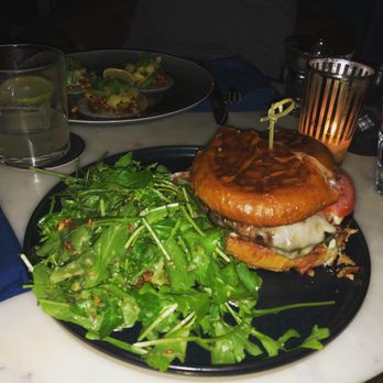 Death & Co - Burger with salad and tacos in the background - Cocktail Bars Near Me - Denver, Colorado
