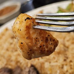 Ichiban Japanese Steakhouse - A half of a scallop on a fork.