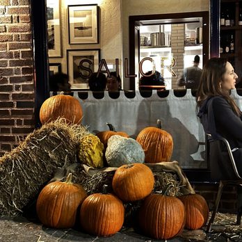 Sailor - a woman sitting at a table with pumpkins - New American Near Me - Brooklyn, New York