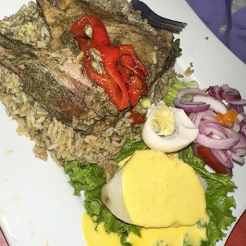 La Casa De Rosita - Duck over rice with Papa a la Huancaina - Peruvian Near Me - Passaic, New Jersey
