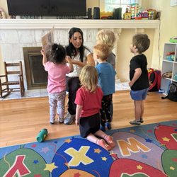 Hanna's Daycare  - Ms Hanna and the kids during a fun story time