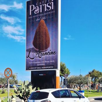 Caffè Parisi - This sign is right outside and across from the arrivals area at nearby CTA airport - Tapas/Small Plates Near Me - Catania, Connecticut
