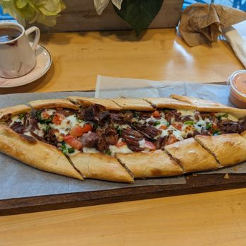 Miss Cafe - Lamb pide with turkish coffee in the upper left. - Turkish Near Me - Seattle, Washington Miss Cafe - Lamb pide with turkish coffee in the upper left. - Turkish Near Me - Seattle, Washington