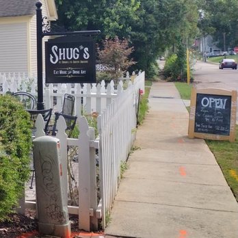 Shug’s at Brooklyn South Square - a sign for shug's - Speakeasies Near Me - Salisbury, North Carolina