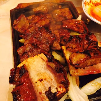 Million Restaurant - marinated kalbi without onions on a steaming plate ~ very delicious ~   !! - Korean Near Me - Honolulu, Hawaii