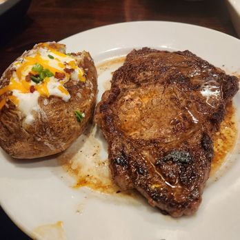 LongHorn Steakhouse - Got the 20oz ribeye and loaded baked potato for my birthday dinner.  Good service,  food was delicious.  I was well pleased. - Steakhouses Near Me - Greensboro, North Carolina