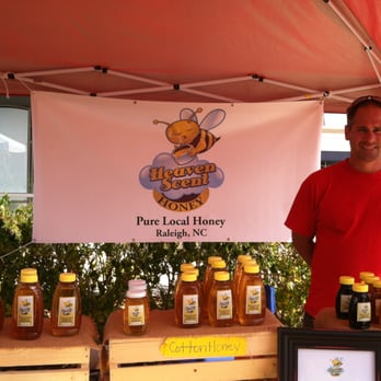 Heaven Scent Honey - a man standing in front of a display of honeys - Specialty Food Near Me Heaven Scent Honey - a man standing in front of a display of honeys - Specialty Food Near Me