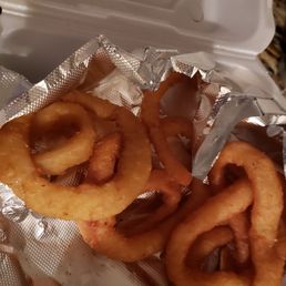 onion rings in a styrofoam container