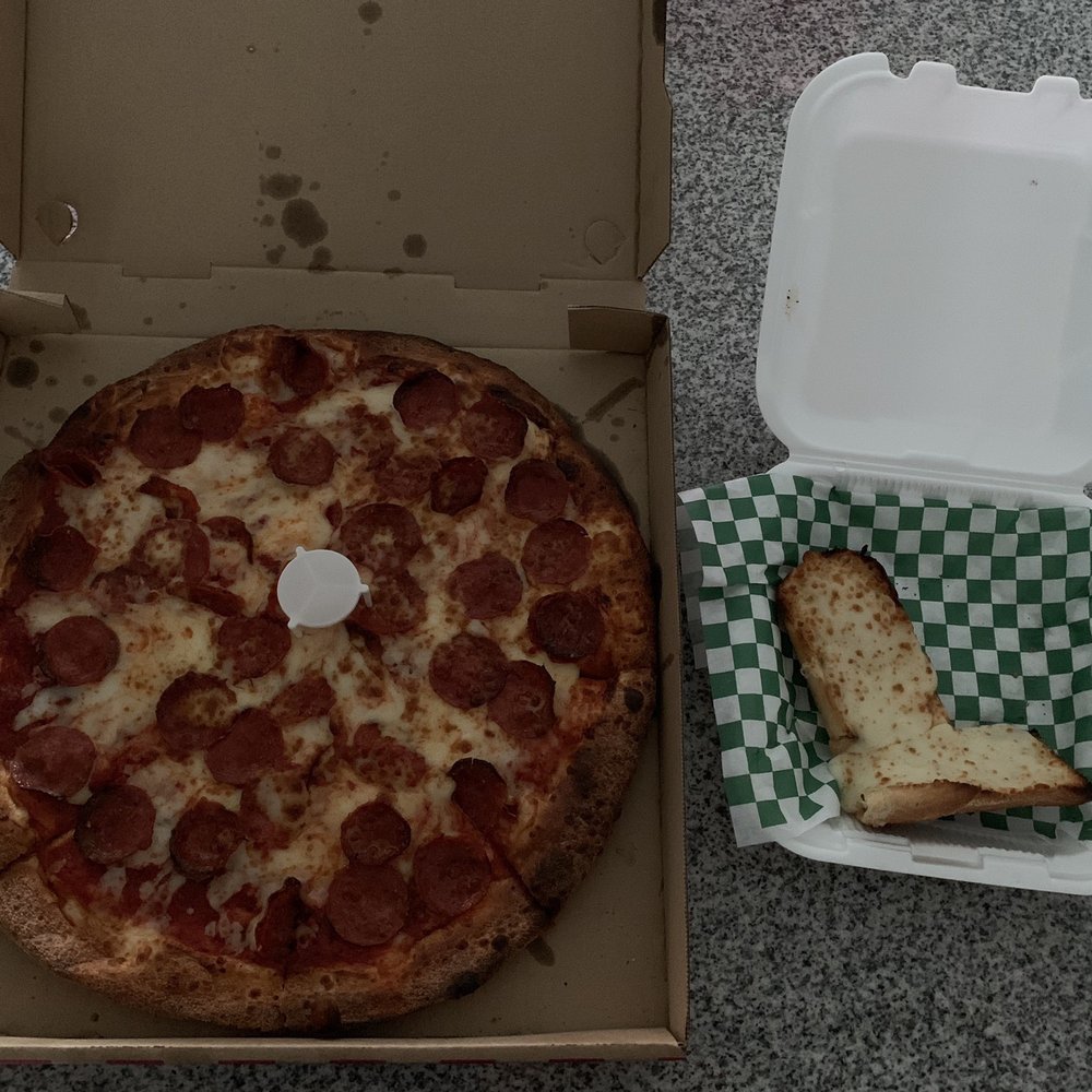 Your Pizza Stop - Large pepperoni pizza and garlic cheese bread. More bread comes with order, but we started eating it before picture was taken :) - Pizza Near Me - Menifee, California Your Pizza Stop - Large pepperoni pizza and garlic cheese bread. More bread comes with order, but we started eating it before picture was taken :) - Pizza Near Me - Menifee, California