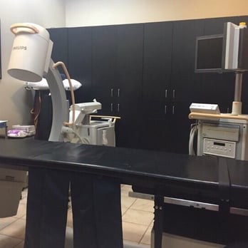 Advanced Pain Management - Procedure room with X-Ray and Table for the patient to lay on. - Physical Therapy Near Me - Glendale, Arizona Advanced Pain Management - Procedure room with X-Ray and Table for the patient to lay on. - Physical Therapy Near Me - Glendale, Arizona