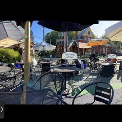The Vine On Main - Some of the plentiful umbrellaed outdoor seating right in front of this wine shop, with lots of parking across Main Street