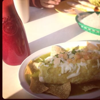 El Rincon Chilango - Burrito mojada de Asada, rise, beans, onions, cilantro, cover with green sauce, sour cream and Swiss cheese, chips on the side, - Mexican Near Me - Santa Ana, California El Rincon Chilango - Burrito mojada de Asada, rise, beans, onions, cilantro, cover with green sauce, sour cream and Swiss cheese, chips on the side, - Mexican Near Me - Santa Ana, California