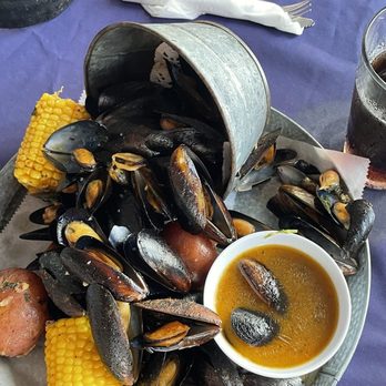Nate's Boathouse - 1lb Mussels with corn on cob and boiled potato with side butter. - Seafood Near Me - Christiansted, Virgin Islands Nate's Boathouse - 1lb Mussels with corn on cob and boiled potato with side butter. - Seafood Near Me - Christiansted, Virgin Islands